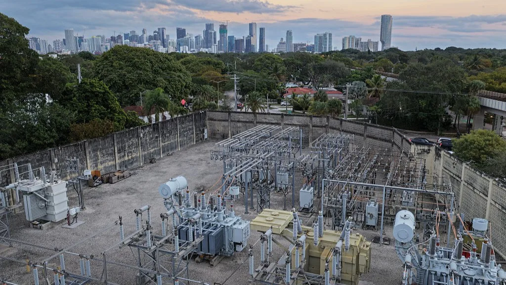View of high voltage power lines running through a sub-station along the electrical power grid in Miami, Florida.